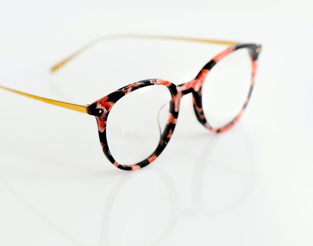 Female fashion glasses on white background